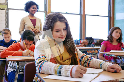 Image of Education, writing and exam with children in classroom of college for academy, knowledge and learning. Study, school and notebook with students and teacher for future, scholarship and goal