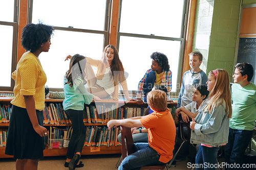 Image of Education library, teacher and children students in classroom of elementary school. Development, learning scholarship and group of kids talking, discussion and studying for knowledge with black woman