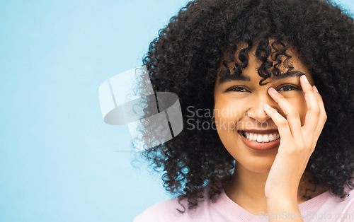 Image of Smile, hands and portrait of black woman on blue background with makeup, cosmetics and fashion mockup. Beauty, advertising and happy face of girl with copy space for sale, promotion and discount