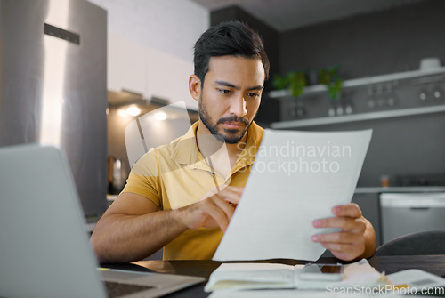 Image of Budget, paperwork and Asian man planning with a laptop for finance, insurance and tax. Payment, note and Japanese entrepreneur reading information on a contract to start a small business from home
