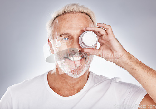 Image of Portrait, senior man and cream for skincare, beauty and cosmetics on grey studio background. Face, mature male and elderly guy with lotion, serum and wellness for treatment, smooth skin and luxury