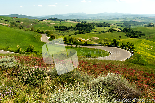 Image of View of valley with hills and road, Tuscany. Italy