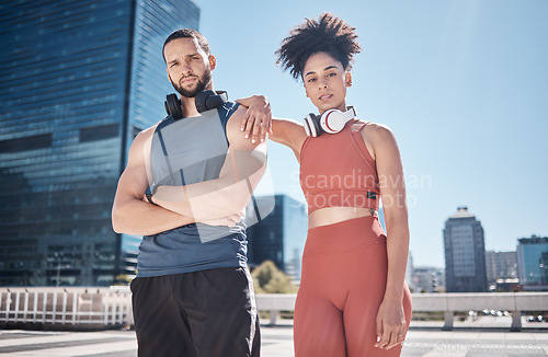 Image of Couple, city portrait and fitness with headphones for music, motivation or outdoor urban workout. Exercise team, black couple and support for health, wellness or training for summer in Cape Town