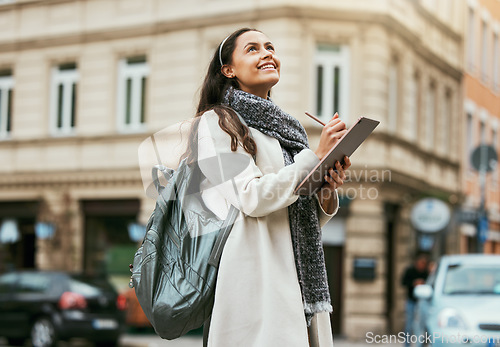 Image of Creative woman, tablet and writing in the city with vision, idea or inspiration for design with smile for travel. Happy female holding touchscreen in thought, write or digital startup in a urban town