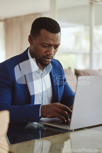 Image of Laptop research, investment and focus of black man planning wealth, entrepreneur profit and stock market. Corporate, business and rich manager, boss or professional person typing on pc for trading