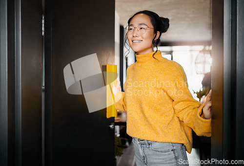 Image of Thinking, smile and Asian woman opening a door to an office at a graphic design startup company. Vision, happy and Japanese designer at the entrance of a workspace with an idea and motivation