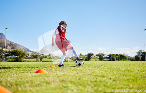 Image of Soccer girl child, field and training for fitness, sports and balance for control, speed and strong body from low angle. Female kid, fast football dribbling and exercise feet on grass in Cape Town