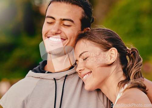 Image of Happy couple, smile and hug embracing relationship and spending quality time together in the outdoors. Man and woman relaxing and smiling for holiday break, fresh air and satisfaction in nature