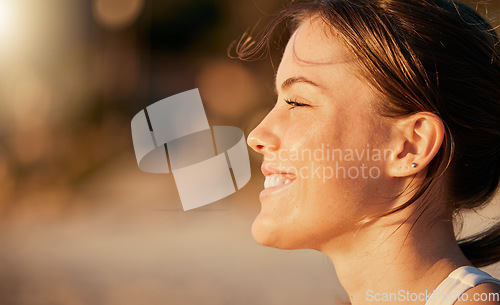 Image of Happy, calm and face of a woman at the beach to relax, breathe and free the mind in Thailand. Freedom, smile and girl in nature for peace, content and stress relief with blurred mockup space