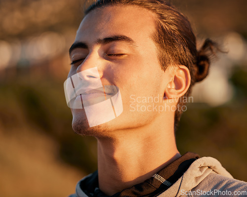 Image of Man, face and smile breathing fresh air for spiritual wellness, health or satisfaction in the nature outdoors. Happy male, person or guy smiling in happiness for freedom, oxygen or calm peace outside