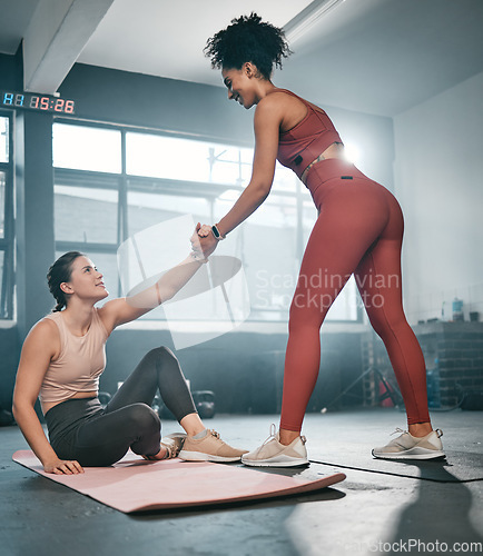 Image of Fitness, personal trainer or black woman helping a girl client at gym with trust or support after workout or exercise. Partnership, helping hand or healthy sports athlete training with a female coach