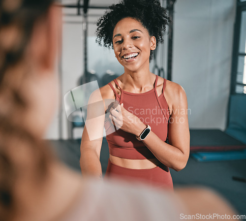 Image of Fitness, personal trainer and black woman shaking hands at gym for team work, trust or support in a workout or exercise. Collaboration, friends or healthy sports athletes handshake in training club