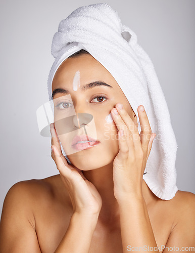 Image of Woman, skin cream and face portrait with facial moisturizer and spa beauty in morning. Towel, sunscreen and wellness care of a young person with cosmetic, collagen and detox dermatology product