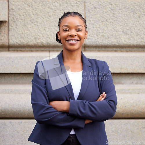 Image of Mission, vision and mindset with a business black woman standing arms crossed outdoor in the city alone. Success, motivation and growth with a female employee looking confident in an urban town