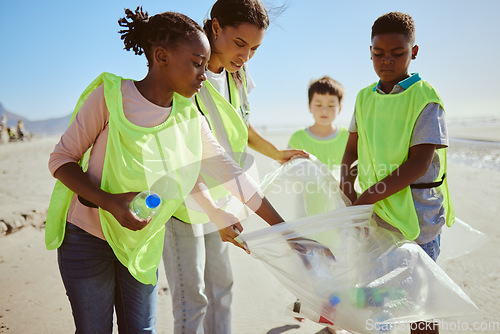 Image of Diversity, beach cleaning and plastic recycling for teamwork, pollution ecology and environmental change collaboration. Eco friendly team, interracial people and ocean garbage recycle together