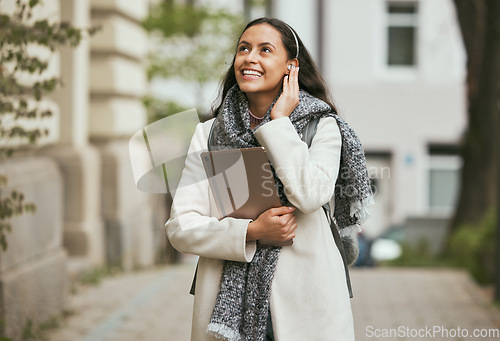 Image of Travel, happy or woman listening to music and walking in London city on a relaxing holiday vacation or weekend. Smile, radio song or excited girl tourist looking at buildings and streaming podcast