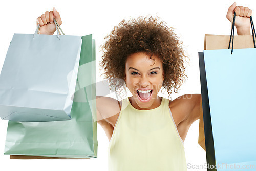 Image of Shopping, retail and black woman customer excited with sale or deal isolated against a studio white background. Portrait of happy, fashion and joyful winner celebrating holding bags at a giveaway