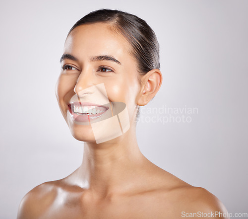 Image of Woman, smile and happy thinking for beauty, skincare wellness and cosmetics dermatology in grey background studio. Model happiness, relax spa facial glow and positive mindset vision for body care.