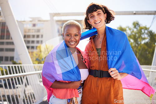 Image of Portrait, outdoor and lesbian couple with flag, lgbtq community and women with smile, pride and queer. Non binary, bisexuals or friends with support, solidarity and proud with sexuality and happiness