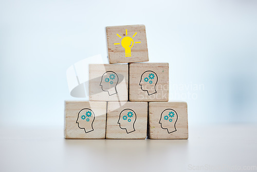 Image of Building blocks, teamwork or brainstorming lightbulb idea on isolated background, mock up or office desk mockup. Zoom, wood or cube in cog head innovation for company thinking or unity growth success