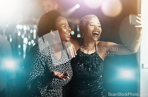 Image of Women, laughing or phone selfie on party dance floor in nightclub event, bokeh disco or birthday celebration. Smile, happy or bonding friends on mobile photography for social media or profile picture