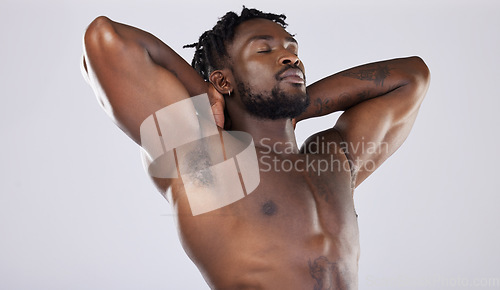 Image of Nude body, skin and black man, muscle and content with strong person, fitness isolated on studio background. Muscular, bodybuilder and natural cosmetics, clean and peace with skincare and naked