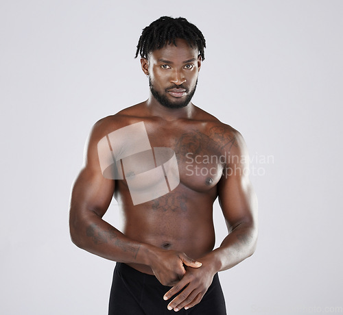 Image of Fitness, black man and body portrait of sports person in studio for strong muscle and power. Health and wellness of a sexy male bodybuilder model with growth after exercise, workout and training