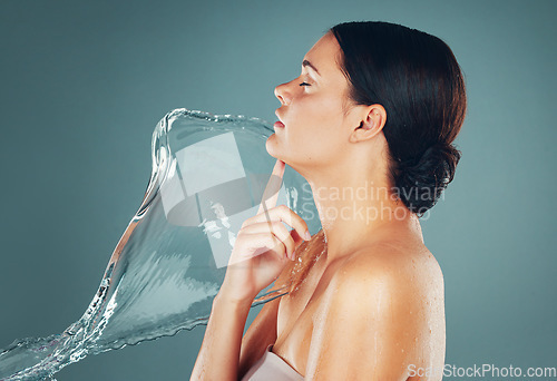 Image of Skin, skincare and water splash on woman body for hygiene and hydration isolated in a studio background. Grooming, shower and female dermatology for young beautiful adult doing self care