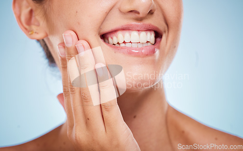 Image of Beauty, teeth and face with woman and hand for manicure, nail care and cosmetics facial, Invisalign and skincare against studio background. Healthy skin, wellness and dermatology with teeth whitening