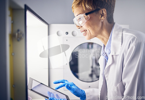 Image of Senior woman, scientist and tablet in lab for research, science innovation with digital results and scientific study. Incubator, experiment and biotechnology with technology, safety goggles and smile