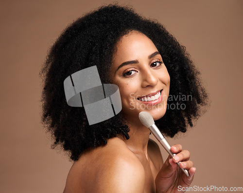 Image of Face portrait, beauty and black woman with makeup brush in studio isolated on a brown background. Skincare, cosmetics tool and happy female model with product to apply foundation for facial wellness.