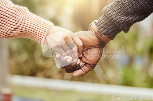 Image of Love, support and trust hands of black couple in marriage together with care, romance and unity. Soulmate, married and man with woman holding hands for romantic bonding moment in nature zoom.