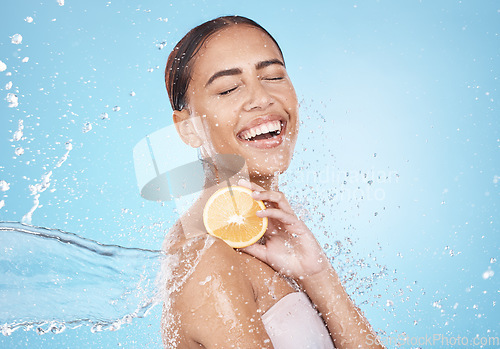 Image of Water, lemon and woman with happy skincare, beauty or cosmetics product in studio or shower mockup for vegan advertising. Wellness model with fruit in hands and splash for healthy dermatology glow