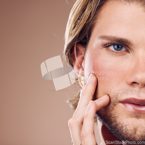 Image of Face, eye and beauty with mockup and man for skincare, cosmetics with microblading, vision and glow against studio background. Cosmetic care, makeup and facial cropped with gender neutral closeup