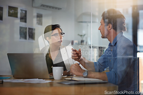 Image of Training, planning and business people in a meeting for a partnership, discussion and brainstorming on a laptop. Teamwork, web design and employees talking about a plan for a website on a pc