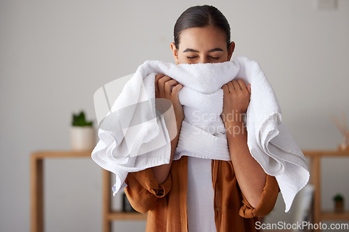 Image of Laundry, fresh and woman smelling a towel after cleaning, housework and washing clothes in the morning. Chores, housekeeping and cleaner with smell of clean clothing after a routine wash at home