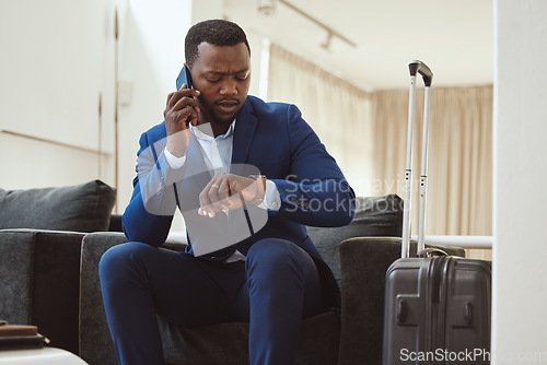 Image of African businessman, checking time in hotel and phonecall for work travel schedule in Atlanta. Young black entrepreneur speaking on cellphone, professional time management or luxury airport travel