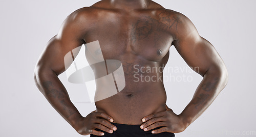 Image of Fitness, closeup and muscular black man, health and wellness with guy on grey studio background. Nigerian male, confident athlete or bodybuilder with torso, stomach and muscles with grooming and pecs