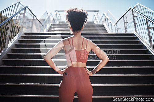 Image of Fitness, woman and stairs for sport in city for running, exercise or healthy cardio preparation. Back of African American female ready for training, workout or sports run for wellness by staircase