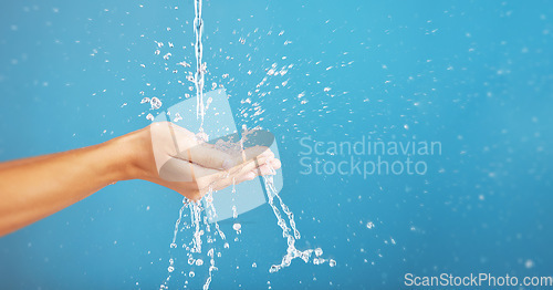 Image of Cleaning, save and hands with water for hygiene, grooming and washing body on a blue background. Shower, beauty and person saving liquid for health, wellness and mockup space on a studio backdrop