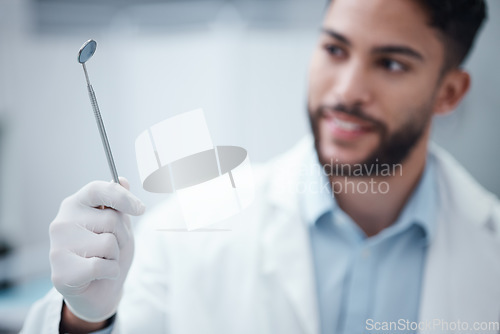 Image of Oral care, dental and mirror in the hand of a dentist man ready for an examination or checkup for hygiene. Doctor, hands and medical with a male orthodontist working in the healthcare sector