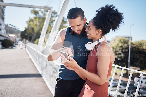 Image of Exercise, fitness and black couple with phone in city for running, marathon training and workout on bridge. Love, sports and man and woman on smartphone for social media, music and health mobile app