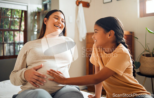 Image of Family, baby and pregnant mother in home with excited, happy and joyful smile of kid touching belly. Indian mom and child waiting for baby sibling and bonding together in bedroom at house.