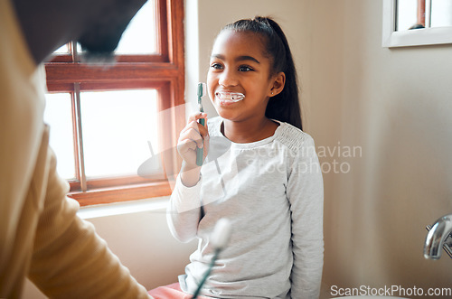 Image of Daughter, father and brushing teeth in a bathroom for hygiene, grooming and bonding. Oral care, girl and parent for morning cleaning while having fun with black family who laugh and smile at home