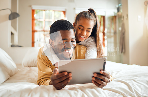 Image of Black family, tablet or learning with a father and daughter lying together on a bed in their home for education. Relax, internet and kids with a man and girl in a bedroom for growth or development