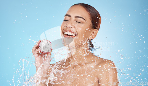 Image of Beauty, skincare and woman with dragon fruit and water in studio for skincare products, cosmetics and spa. Wellness, detox and happy girl with fruit for natural, organic and healthy facial treatment