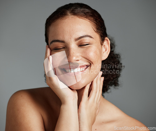 Image of Face, beauty and satisfaction with a model black woman in studio on a gray background to promote natural skincare. Facial, wellness and makeup with an attractive young female happy with cosmetics