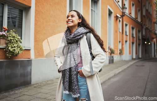 Image of Excited, travel and walking woman in the city street for adventure, exploring and smile at architecture in France. Thinking, happy and girl on a walk in the road with an idea during a holiday