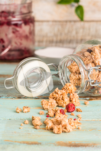 Image of Glass jar with healthy breakfast cereal 