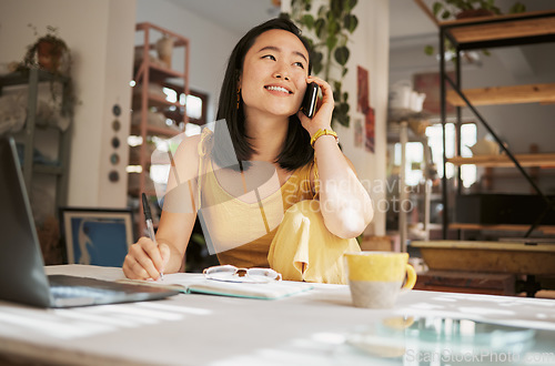 Image of Notebook, creative startup and Asian woman on a phone call for planning, conversation and talking to client. Communication, networking and girl with smartphone, laptop and ideas for art business